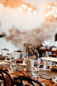 Table decor consisting of dried flowers in a vase at Petrichor Farm.