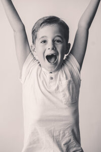 Young boy smiles at the camera during Personality Portrait Photoshoot in Charleston, SC.