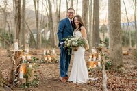 Styled bridal portrait with candles and winter floral design by Flowergirl Cville, Charlottesville wedding florist | Photo by Xiaoqi Li Photography
