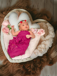 4Karma Studio - A fine art newborn portrait in Southern California featuring a sleeping baby styled with custom textures and organic props in a true-to-life style.
