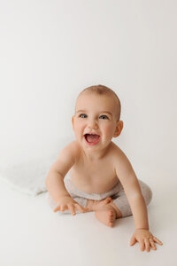 smiling baby during studio milestone portrait session in Burbank