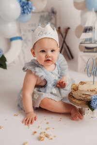Baby celebrates her 1st birthday with a Cake Smash Photoshoot at Holy City Babies Portrait Studio in Charleston, SC.