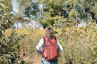 Jess walking on trail from behind - retro
