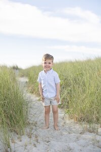 A coastal New England family session with toes in the sand and salty snuggles by the water's edge. North Shore Family Photographer. Deborah Zoe Photography.
