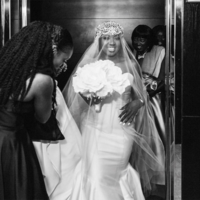 Destination Wedding Photo of Bride: Black and white photo of bride exiting the elevator in Florida for White House Wedding Photography