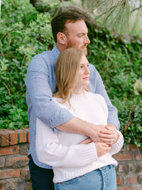 A serene engagement moment at The Lodge at Torrey Pines captured by Michael Asmussen Photography. Amid whispering pines and timeless California architecture, the couple celebrates with rosé and effortless laughter—an image of warmth, elegance, and genuine connection.