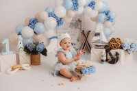 Baby celebrates her 1st birthday with a Cake Smash Photoshoot at Holy City Babies Portrait Studio in Charleston, SC.