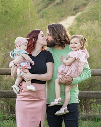 Family Photo with mam and dad kiss each other