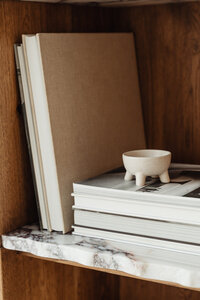 kaboompics_Books on a bookcase - marble shelves