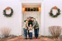 Mother smiling with her children during an outdoor family photography session in New Bern