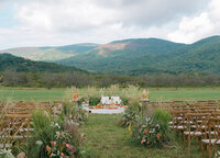 Outdoor ceremony at Henley's Orchard with florals by Flowergirl Cville. Navodita KC Photography.