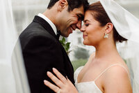 Bride and groom embrace during golden hour after ceremony in Tennessee