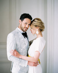 Young couple embraces during their French Chateau elopement