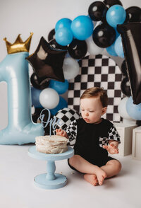 Baby celebrates his first birthday with Cake Smash Pictures at Holy City Babies Portrait Studio in Charleston, SC.