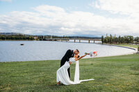 Bride and groom portraits overlooking Lake Burley Griffin in Canberra ACT