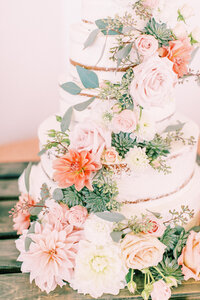 naked wedding cake with cascading florals