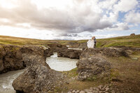 bride and groom kissing in iceland