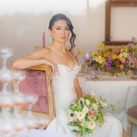 luxury bride through window with champagne tower at hollins house in santa cruz