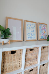 Display of embroidered hoop art arranged on wooden shelf in studio. Photograph by Yucaipa branding photographer Kaitlyn Dawn Photography.