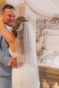 bride and groom stone writing at san francisco city hall wedding
