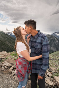 Couple kissing right after the proposal near Big Bear Lake during a romantic outdoor engagement photo session.