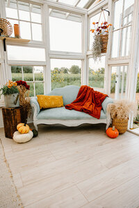 gravel-and-grace-glasshouse-blue-settee-fall-pumpkins.jpg