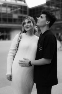 Elegant and chic motherhood portrait of a mom-to-be - minimalist studio photography with a cinematic feel