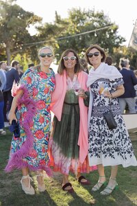 Guests enjoy outdoor cocktail hour during Nantucket wedding reception.