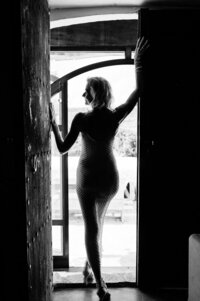 Boudoir experience in doorframe backlit