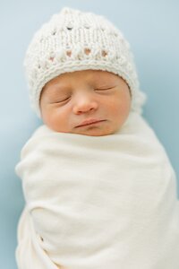newborn in knit hat