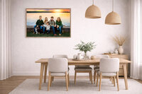 Large framed family portrait at sunset by the Trent River in New Bern displayed above dining table in light modern dining room