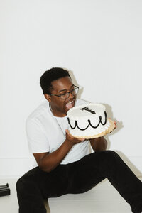 Kendrick of KJB Studios enjoying a slice of wedding cake