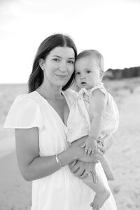 A coastal New England family session with toes in the sand and salty snuggles by the water's edge. North Shore Family Photographer. Deborah Zoe Photography.