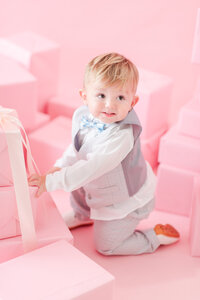 baby toddler in a pink christmas editorial set for Miami Christmas Mini Sessions