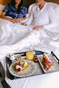 in-room breakfast service delivered to a couple at Estancia La Jolla