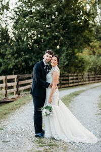 Bride and groom portrait along a gravel path at Bradshaw Duncan House, a scenic wedding venue near Louisville Kentucky.
