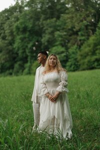 Engaged couple posing together on Pigeon Trail near Kennesaw Mountain.