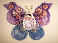 4Karma Studio - Fine art newborn portrait in San Francisco featuring a sleeping baby nestled in organic florals and rustic textures with true-to-life colors.