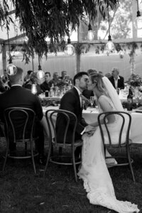 Black and white candid moment during wedding speeches