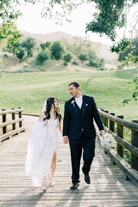 Bride and groom celebrating their wedding day at Eagle Ridge Golf Course in Gilroy, California, with lush fairways and rolling hills in the background.