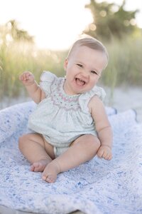 A coastal New England family session with toes in the sand and salty snuggles by the water's edge. North Shore Family Photographer. Deborah Zoe Photography.