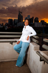 Lipscomb senior on the pedestrian bridge at sunset in Nashville