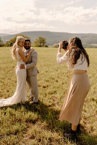 photographer taking a photo of couple