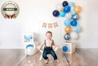 First Birthday Portrait Session baby smiling at the camera.