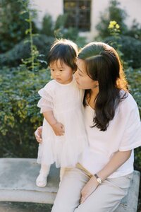 A quiet moment between mother and daughter during their family photo session at Allied Arts Guild
