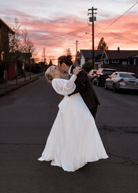 Bride and Groom kissing at Sunset outside of Mildred Hall in Portland Oregon