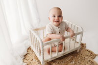 Charleston Motherhood Photographer - Mother poses with her baby during studio Mother's Day Mini Sessions at Holy City Babies Portrait Studio in Charleston, SC.