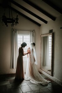 Bride getting ready inside Yew Dell Botanical Gardens wedding venue