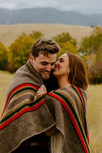 Couple embraces during a fall photography session.