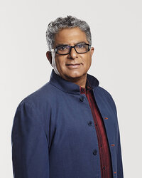 Dr. Deepak Chopra in a composed portrait, emphasizing his calm demeanor and insightful presence, captured by Ylva Erevall.